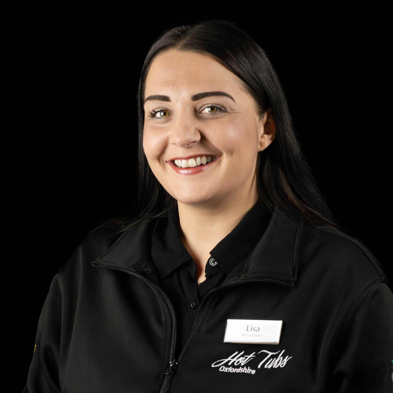 A headshot ofLisa Nichollsagainst a black background