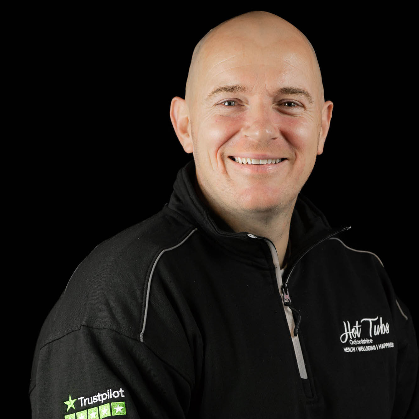 A headshot of Kenny Massey against a black background