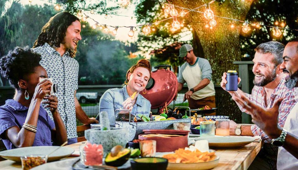 group enjoying outdoor cooking